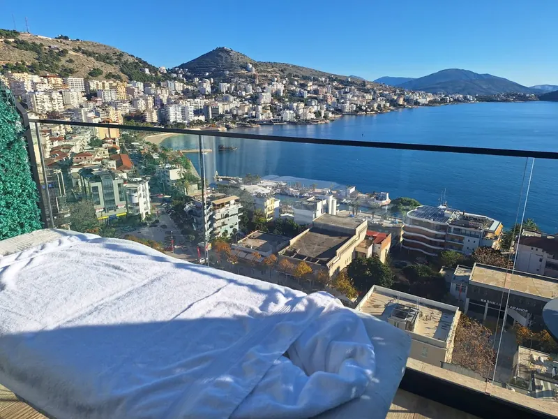 Massage bed on a balcony above Sarandë bay