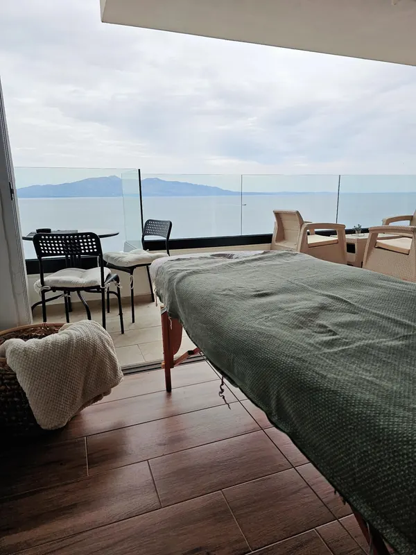 Massage bed on a terrace facing the sea